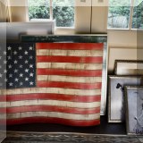A15. Wooden flag and framed artwork. 